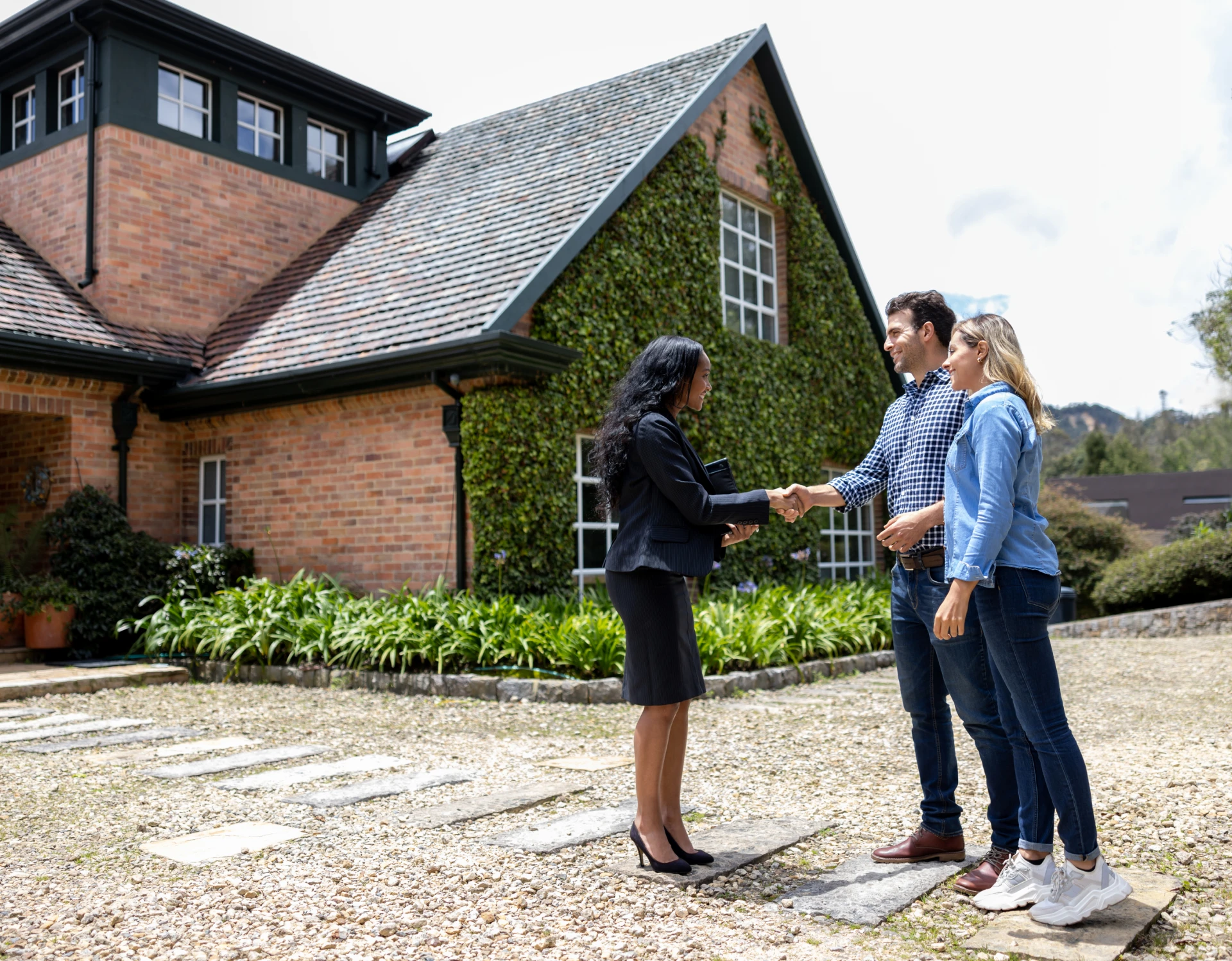 Couple viewing house with agent